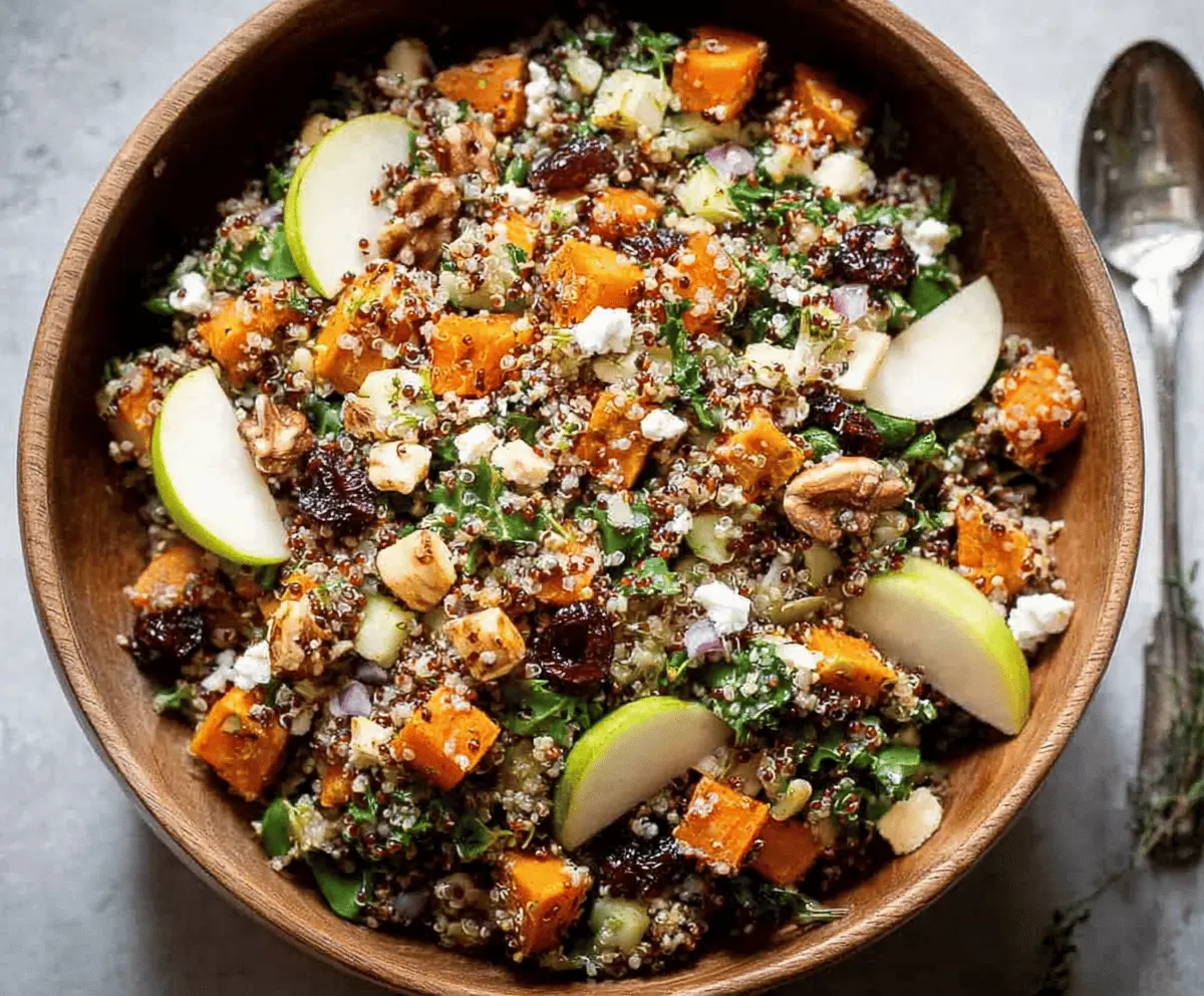 Colorful Fall Harvest Quinoa Salad with roasted vegetables, cranberries, and fresh herbs in a bowl, perfect for autumn meals