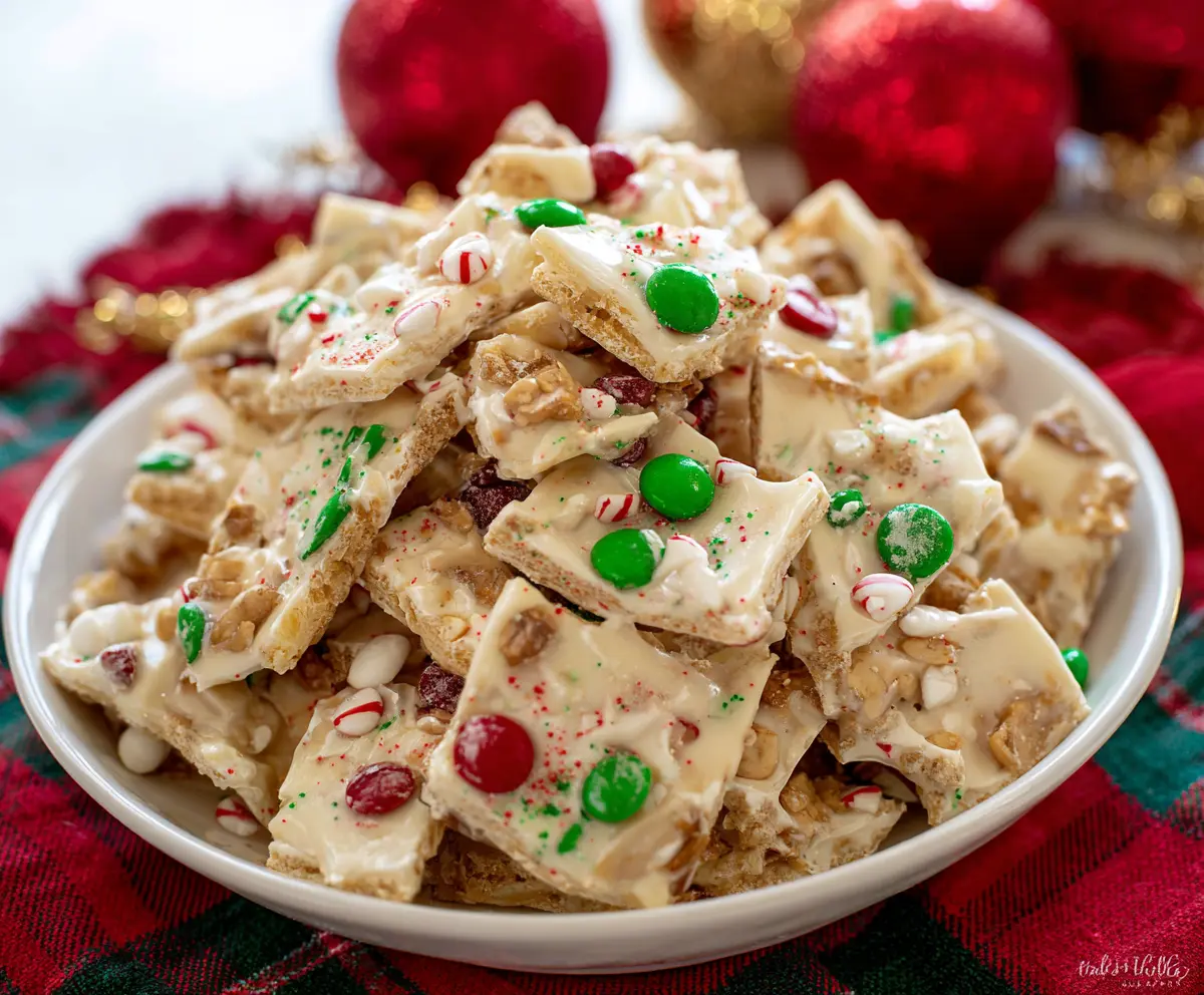 Sweet white chocolate Christmas crack served on a festive holiday platter.